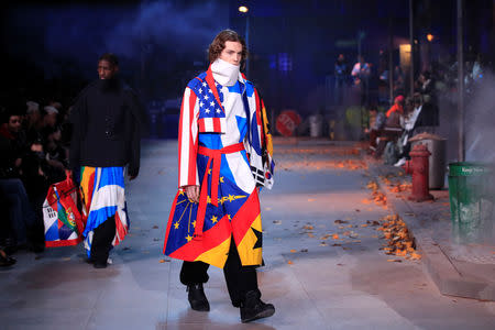 Models present creations by designer Virgil Abloh as part of his Fall/Winter 2019-2020 collection show for fashion house Louis Vuitton during Men's Fashion Week in Paris, France, January 17, 2019. REUTERS/Gonzalo Fuentes