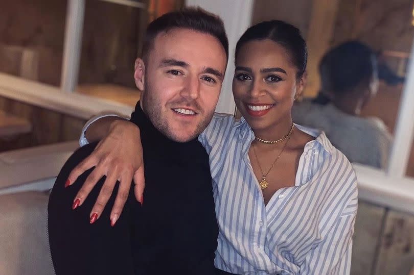 Alan Halsall and Tisha Merry posing together