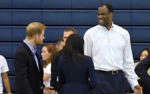 Meghan and Harry meet their match in basketball player David Robinson - Credit: Karwai Tang