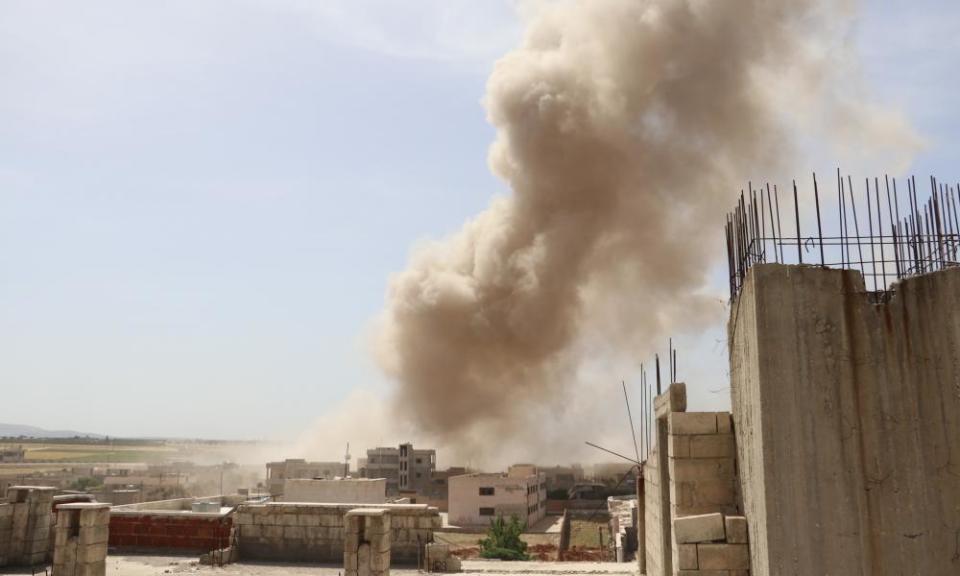 Smoke rises after an airstrike in Idlib