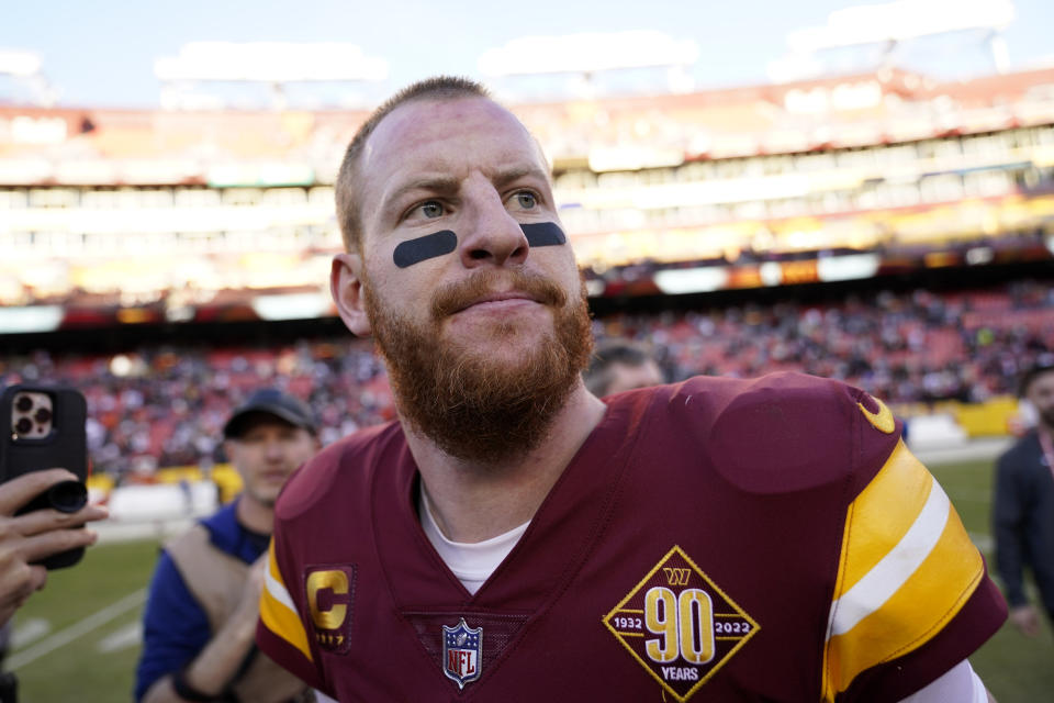 Washington Commanders quarterback Carson Wentz walks off the field after a 24-10 loss to the Cleveland Browns, Sunday, Jan. 1, 2023, in Landover, Md. (AP Photo/Patrick Semansky)