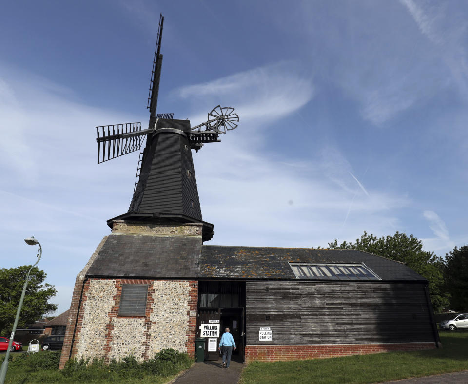 A woman arrived at a polling station located in West Blatchington Windmill near Hove, south east England, Thursday May 23, 2019, as polls opened in elections for the European Parliament. (Steve Parsons/PA via AP)