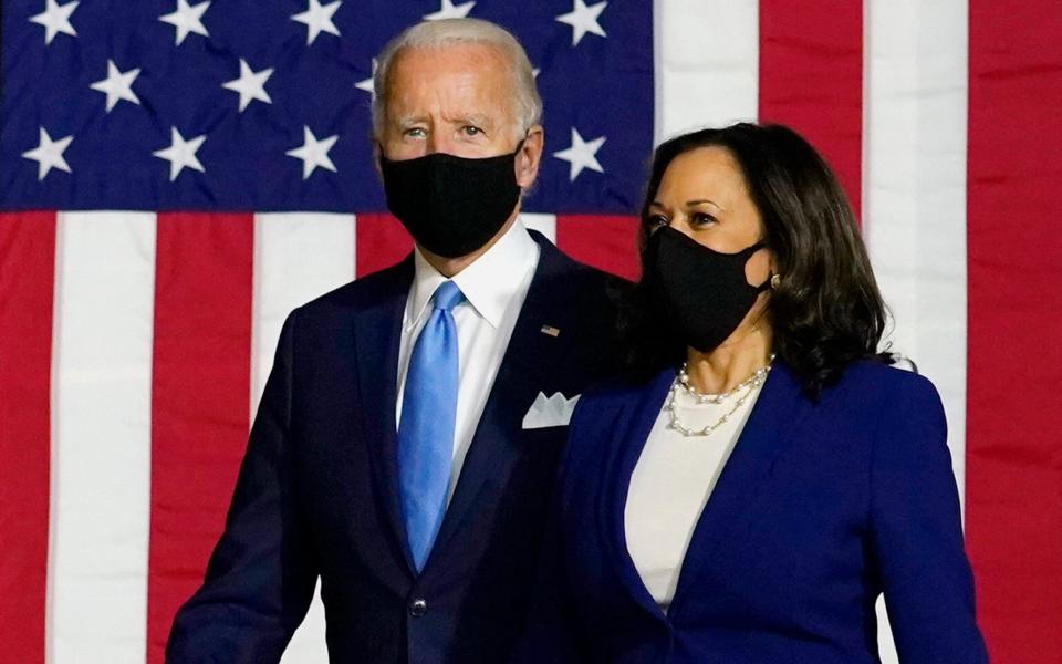 Democratic presidential candidate former Vice President Joe Biden and his running mate Sen. Kamala Harris, D-Calif., arrive to speak at a news conference at Alexis Dupont High School in Wilmington, Del., Wednesday, Aug. 12, 2020 - Carolyn Kaster/AP