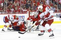 Apr 20, 2019; Washington, DC, USA; Washington Capitals goaltender Braden Holtby (70) prepares to make a save Carolina Hurricanes right wing Justin Williams (14) in the second period in game five of the first round of the 2019 Stanley Cup Playoffs at Capital One Arena. Mandatory Credit: Geoff Burke-USA TODAY Sports