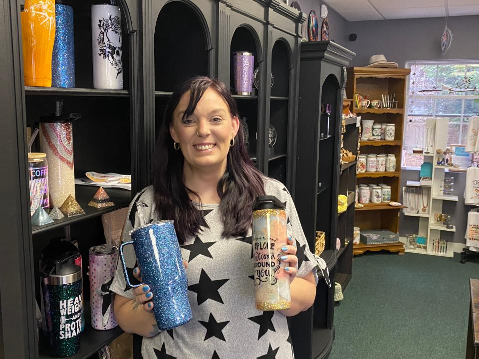 Corinne McCarthy, co-owner of The Soulful Palette, located at 88 East Grove St. in Middleboro, showing off a few resin tumblers she makes herself. February 2, 2024.