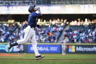 Seattle Mariners' Jorge Polanco reacts as he jogs the bases after hitting a two-run home run against the Atlanta Braves during the third inning of a baseball game Tuesday, April 30, 2024, in Seattle. (AP Photo/Lindsey Wasson)