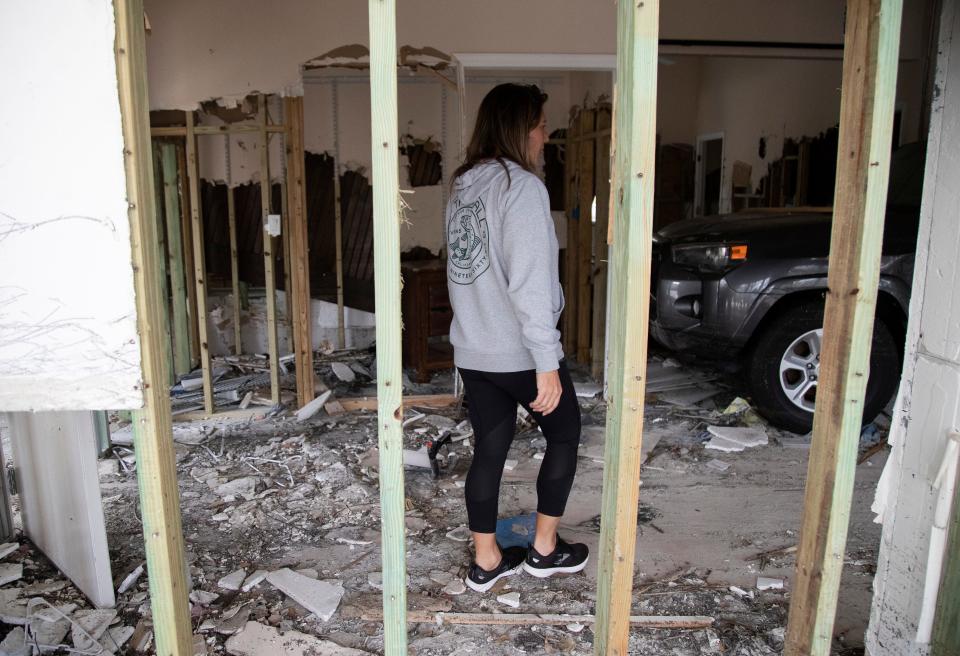 Amy Marto walks through what is left of her apartment on Sanibel on Thursday, Oct. 21, 2022. Her Forerunner ended up inside of her apartment and all of her possessions were washed away by Hurricane Ian. 