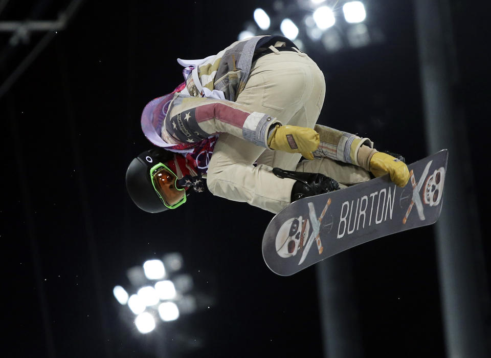 Shaun White of the United States gets air during a snowboard half pipe training session at the Rosa Khutor Extreme Park at the 2014 Winter Olympics, Monday, Feb. 10, 2014, in Krasnaya Polyana, Russia. (AP Photo/Sergei Grits)