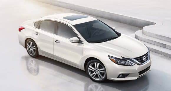 A white Nissan Altima midsize sedan, seen from above.