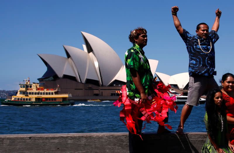 FILE PHOTO: Representatives from South Pacific nations pose during an official launch of their campaign against the coal industry in front of the Sydney Opera House