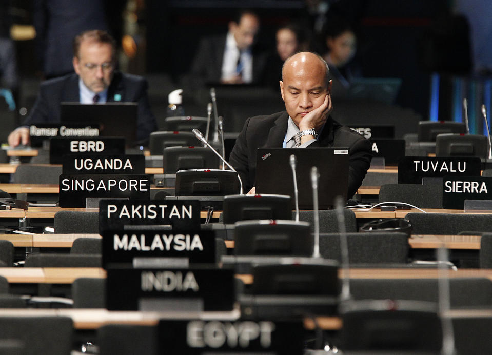 Participants work at the plenary room during the Climate Change Conference COP24 in Katowice , Poland, Tuesday, Dec. 4, 2018.(AP Photo/Czarek Sokolowski)