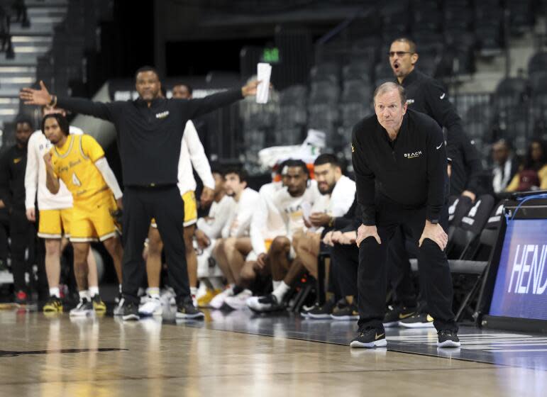 Long Beach State coach Dan Monson watches his team play against UC Davis in Big West tournament championship