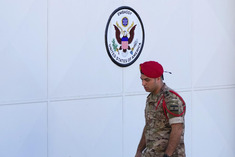 A Lebanese Army investigator collects forensic evidence outside U.S. Embassy in Aukar, a northern suburb of Beirut, Lebanon, Thursday, Sept. 21, 2023. Lebanon's security agencies have launched an investigation into a late night shooting outside the U.S. embassy in Lebanon that caused no injuries, officials said Thursday. (AP Photo/Hassan Ammar)