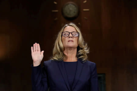 Christine Blasey Ford is sworn in before testifying the Senate Judiciary Committee in the Dirksen Senate Office Building at the Capitol Hill in Washington, DC, U.S., September 27, 2018. Win McNamee/Pool via REUTERS