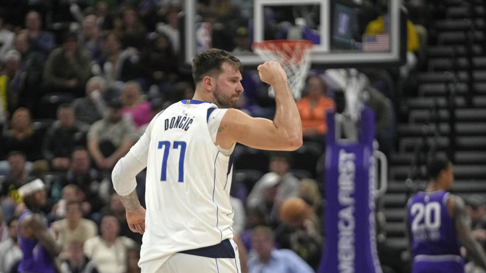 Dallas Mavericks guard Luka Doncic (77) celebrates during the second half of an NBA basketball game against the Utah Jazz Monday, March 25, 2024, in Salt Lake City. (AP Photo/Rick Bowmer)