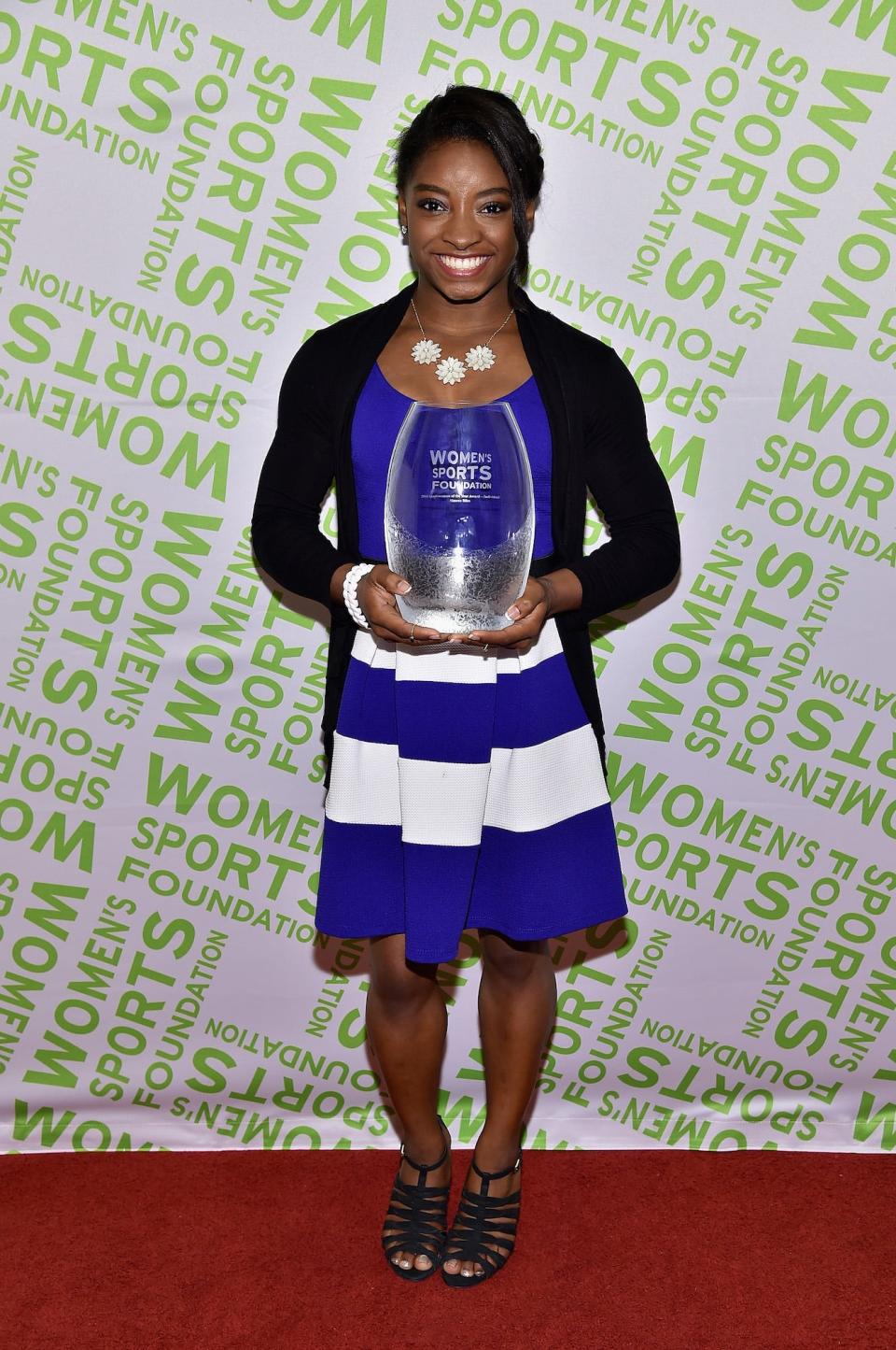 Simone Biles at the 2014 Salute to Women In Sports Awards red carpet.