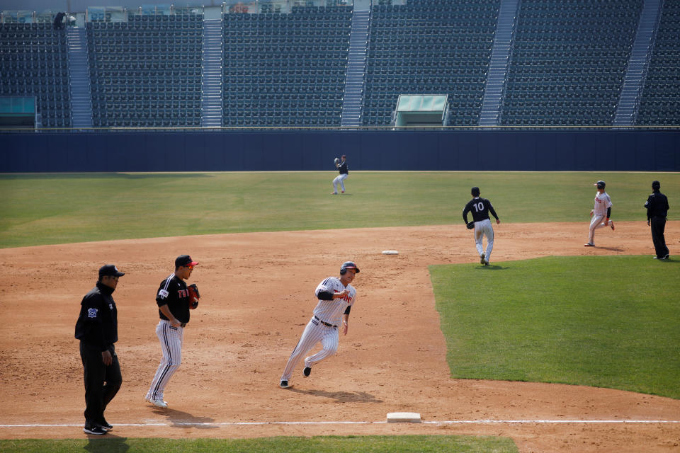 LG Twins team players play their intra-team game to be broadcasted online for their fans at a stadium emptied due to the spread of the coronavirus disease (COVID-19) in Seoul, South Korea, April 2, 2020. Picture taken April 2, 2020.  REUTERS/Kim Hong-Ji