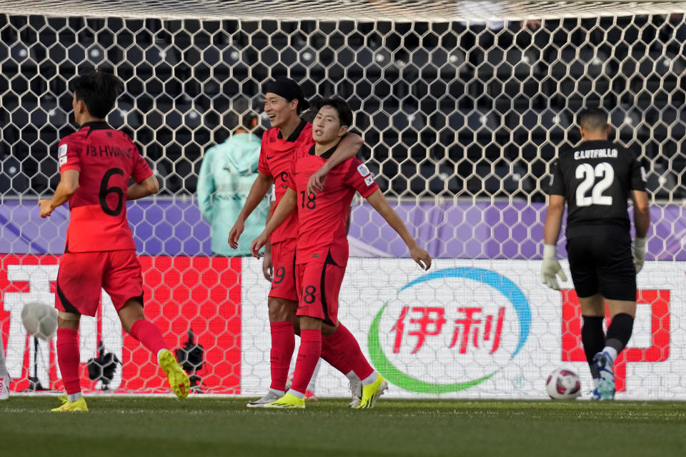 South Korea's Lee Kang-in, third left, celebrates with teammates after scoring his side's third goal during the Asian Cup Group E soccer match between South Korea and Bahrain at Jassim Bin Hamad Stadium in Doha, Qatar, Monday, Jan. 15, 2024. (AP Photo/Thanassis Stavrakis)