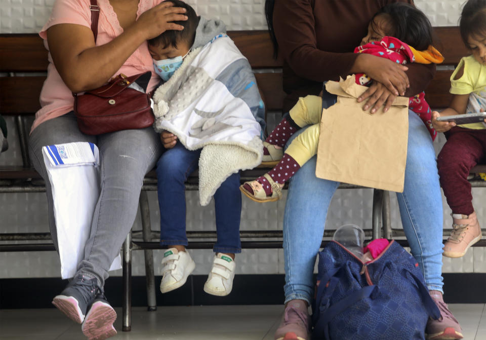 FILE - Children with dengue wait to be seen by doctors at the Mario Ortiz Children's Hospital in Santa Cruz, Bolivia, Feb. 16, 2023. Dengue is sweeping across the Western Hemisphere in numbers not seen since record-keeping began more than four decades ago. (AP Photo/Ipa Ibanez,File)