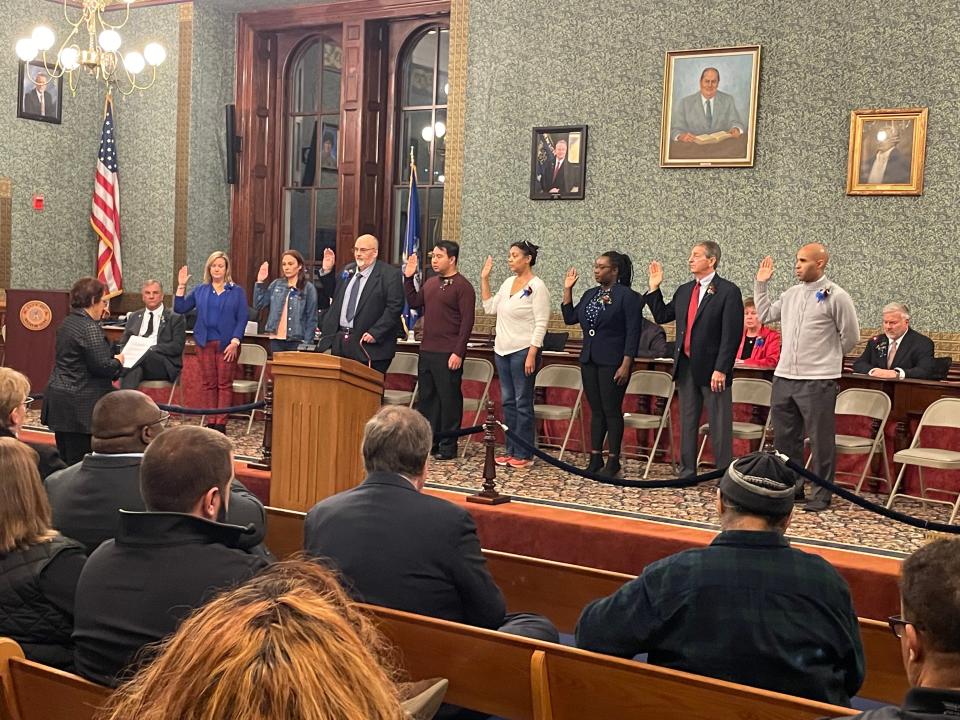 The Norwich Board of Education being sworn in Tuesday night. The man sitting on the left, Robert Buckley, was sworn in as treasurer afterwards.