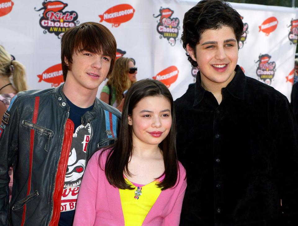 Actors of the Nickelodeon series “Drake & Josh” (L-R) Drake Bell, Miranda Cosgrove and Josh Peck arrive at the 18th Annual Kids Choice Awards at UCLA's Pauley Pavillion on April 2, 2005 in Westwood, California. Bell and Peck are best known for their roles on Nickelodeon's “The Amanda Show” and “Drake & Josh”.