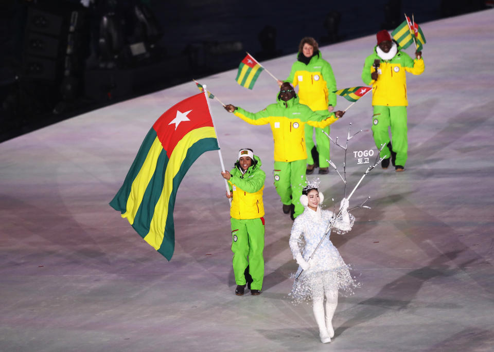 <p>Flag bearer Mathilde-Amivi Petitjean of Togo leads the team during the Opening Ceremony of the PyeongChang 2018 Winter Olympic Games at PyeongChang Olympic Stadium on February 9, 2018 in Pyeongchang-gun, South Korea. (Photo by Ronald Martinez/Getty Images) </p>