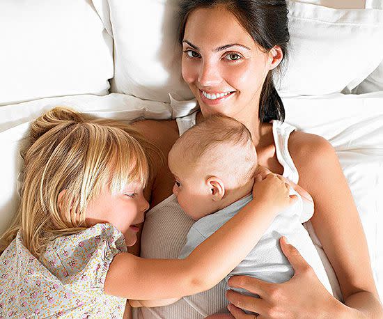 Mom with kids on bed