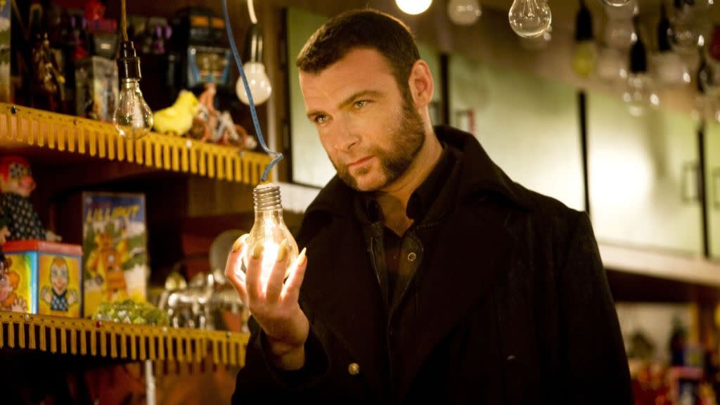 Liev Schreiber as Sabretooth holding a lightbulb