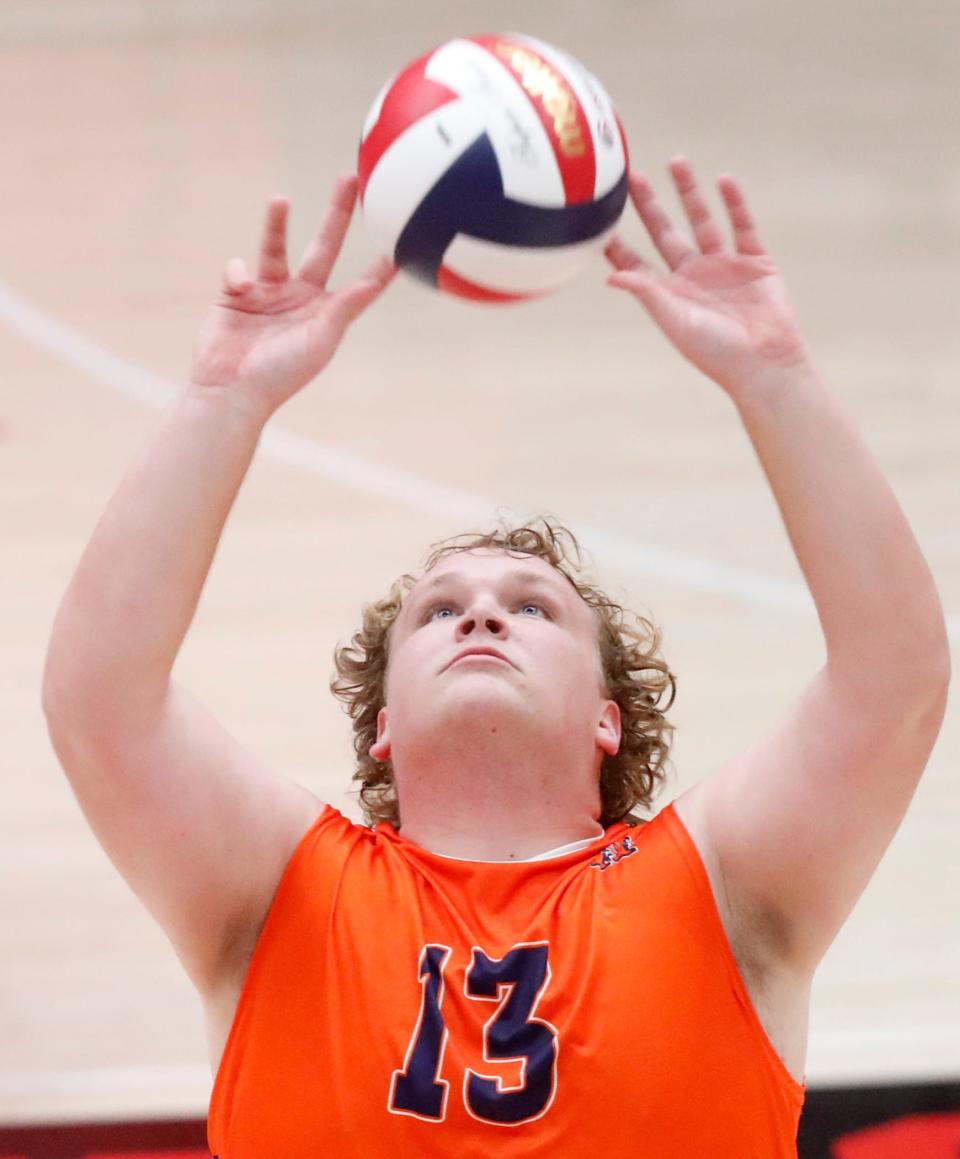 Harrison Raiders setter Conner Blevins (13) sets the ball during the IBVCA volleyball sectional championship match against the Westfield Shamrocks, Saturday, May 11, 2024, at Lafayette Jeff High School in Lafayette, Ind. Westfield won 3-0.