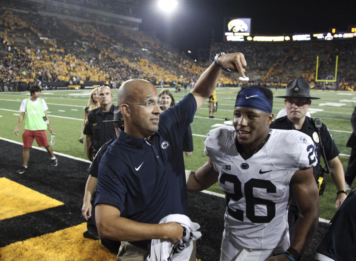 Saquon Barkley (R) was the best player on the field vs. Iowa on Saturday. (Getty Images)