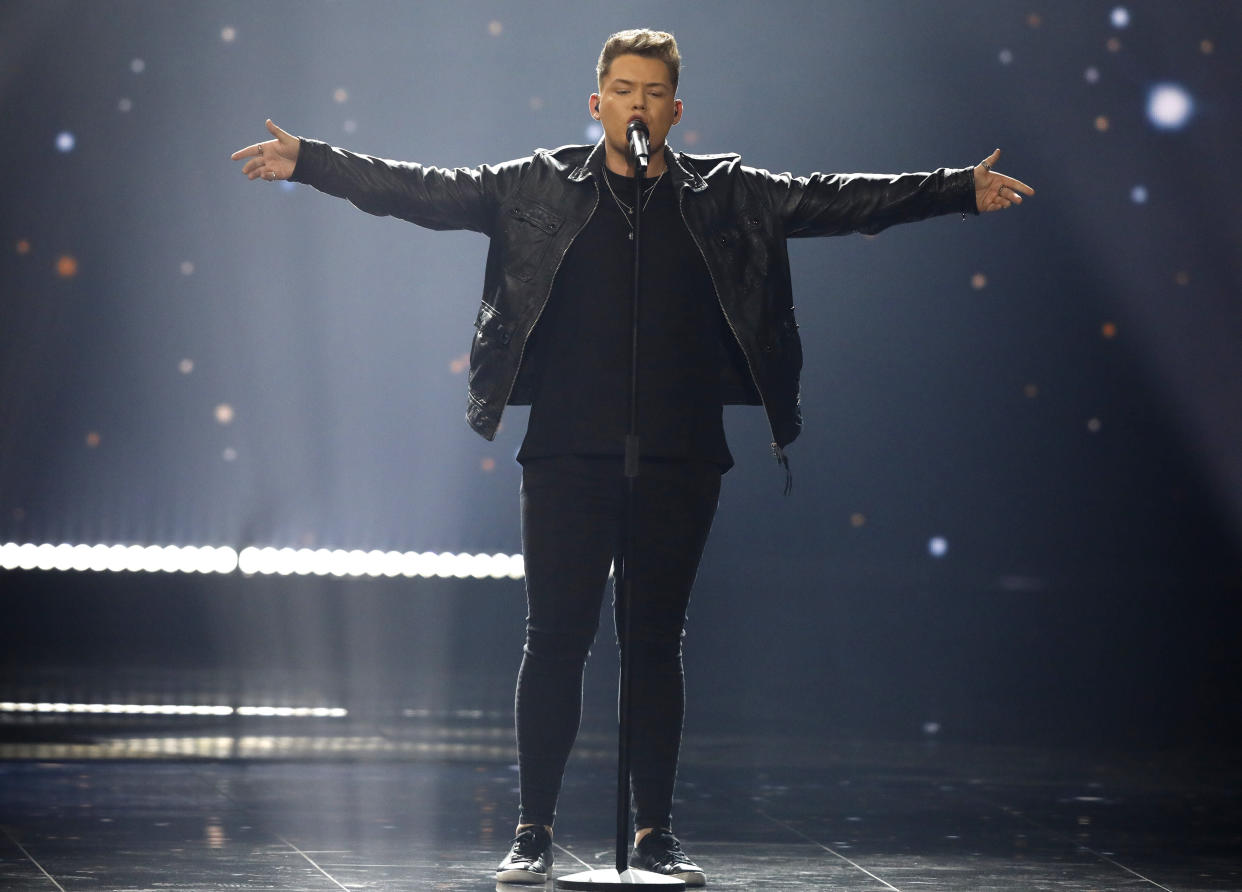 Michael Rice of Great Britain performs the song "Bigger Than Us" during the 2019 Eurovision Song Contest grand final in Tel Aviv, Israel, Saturday, May 18, 2019. (AP Photo/Sebastian Scheiner)