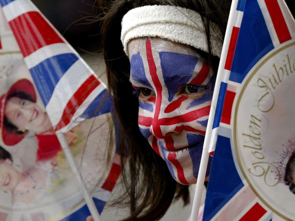 Lina Sultana, 8 has her face painted with the Union Jack flag to celebrate Britain's Queen Elizabeth II's Golden Jubilee at a street party (Getty Images)