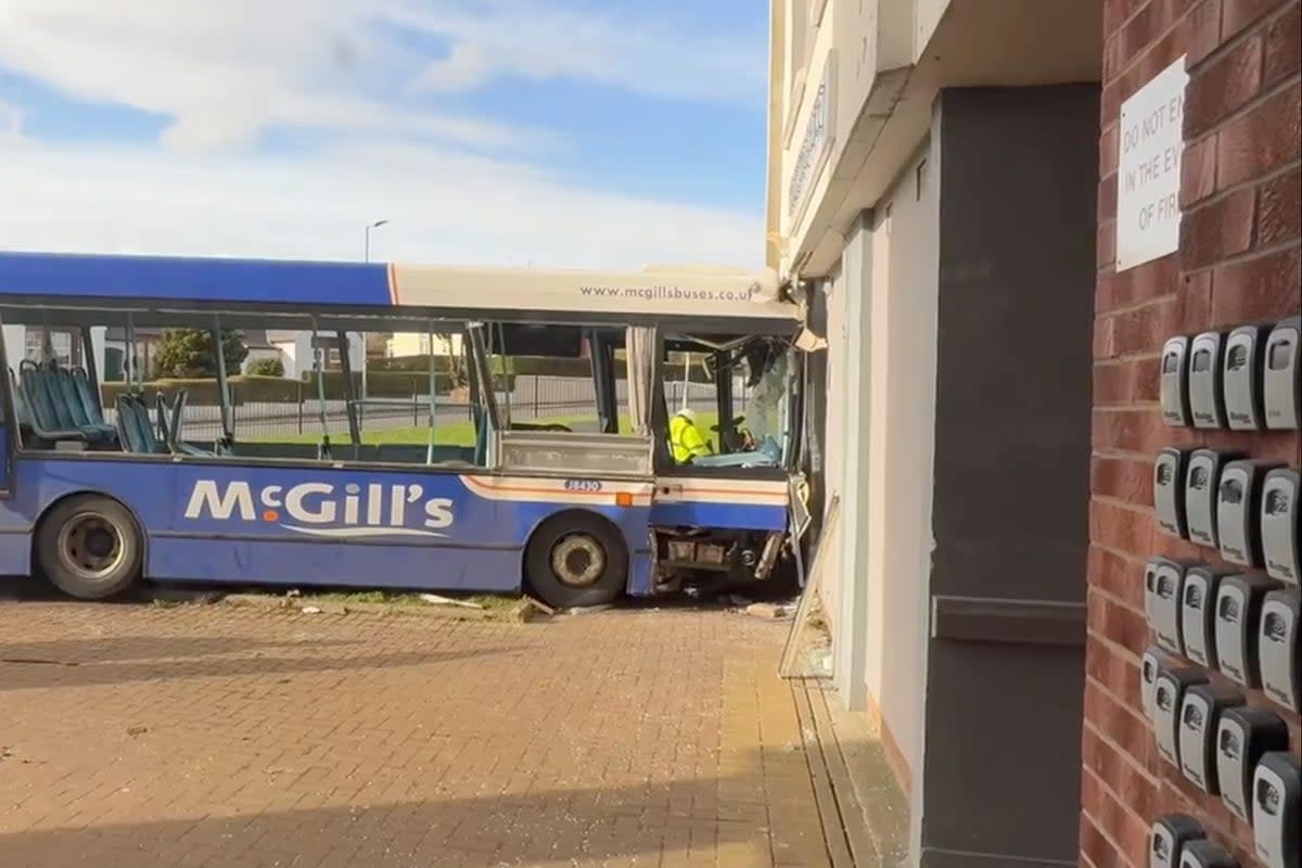 A bus has crashed into a block of flats in Paisley (Sky News screengrab)