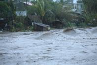 Ferocious winds and torrential rain toppled power lines, triggered flooding and sparked landslides
