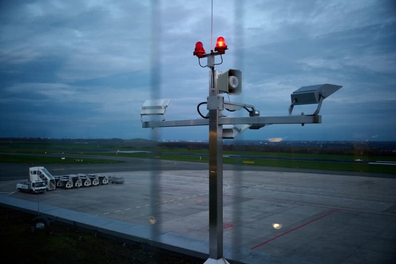 A general view of the airfield through the glass panes of the visitors terrace. Flight operations at Dortmund Airport in western Germany were interrupted for about an hour on Wednesday after two people suffered minor injuries in an accident involving a small airplane. Bernd Thissen/dpa