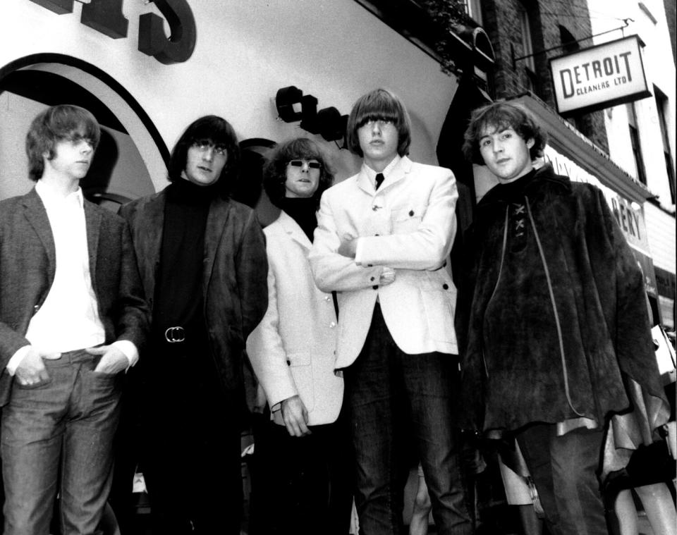 Five members of a rock band in the mid 1960s