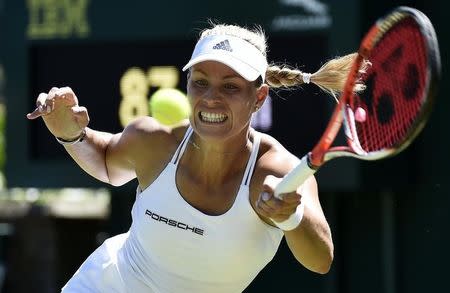 Angelique Kerber of Germany plays a shot during her match against Carina Witthoeft of Germany at the Wimbledon Tennis Championships in London, June 30, 2015. REUTERS/Toby Melville