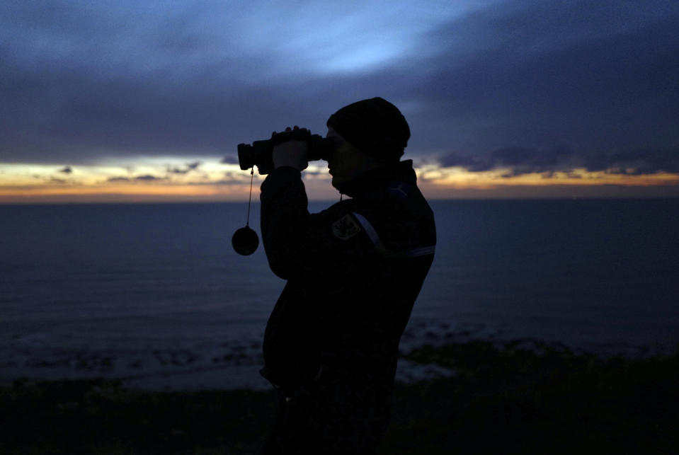 French gendarme patrols the beach in Ambleteuse near Calais, northern France, Friday, Jan. 18, 2019. Land, sea and air patrols are combing the beaches, dunes and frigid, murky coastal waters of northern France in a bid to end an unusual high-risk tactic by migrants, mostly Iranians: trying to sneak across the English Channel in rubber rafts. (AP Photo Michel Spingler)