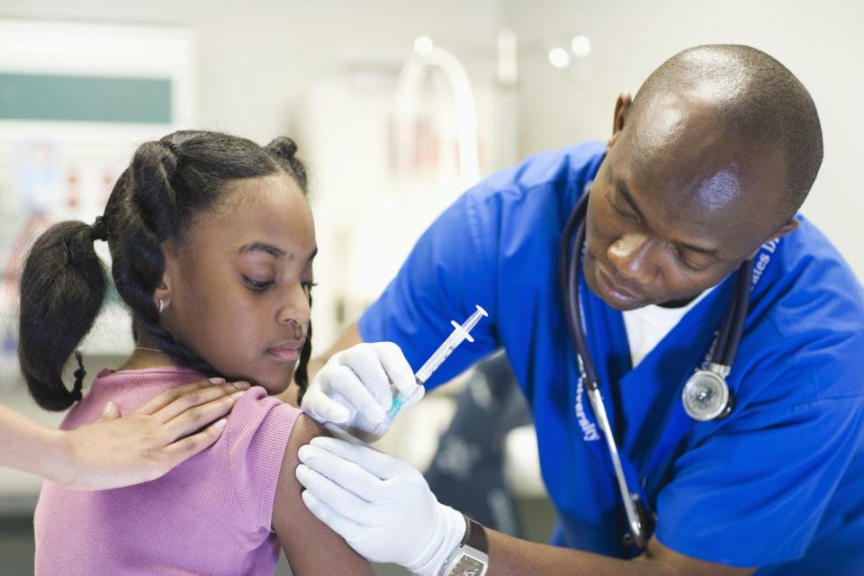 <span class="caption">Phase III trials for a COVID-19 vaccine are underway in multiple countries.</span> <span class="attribution"><a class="link " href="https://www.gettyimages.com/detail/photo/african-american-nurse-giving-patient-injection-royalty-free-image/103919215?adppopup=true" rel="nofollow noopener" target="_blank" data-ylk="slk:ER Productions Limited/Getty Images;elm:context_link;itc:0;sec:content-canvas">ER Productions Limited/Getty Images</a></span>