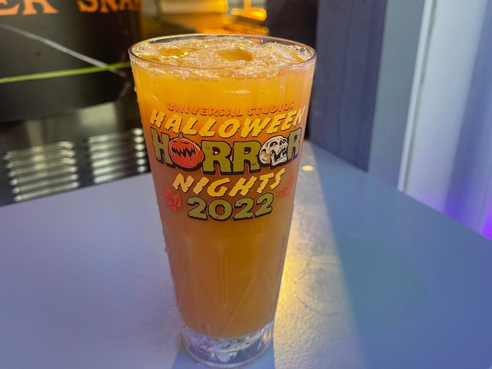 pumpkin gingerbread smash cocktail in signature glass from halloween horror nights