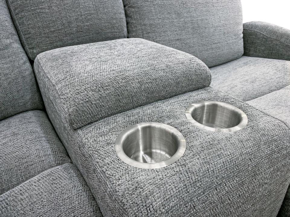 gray cushion sofa with cupholders