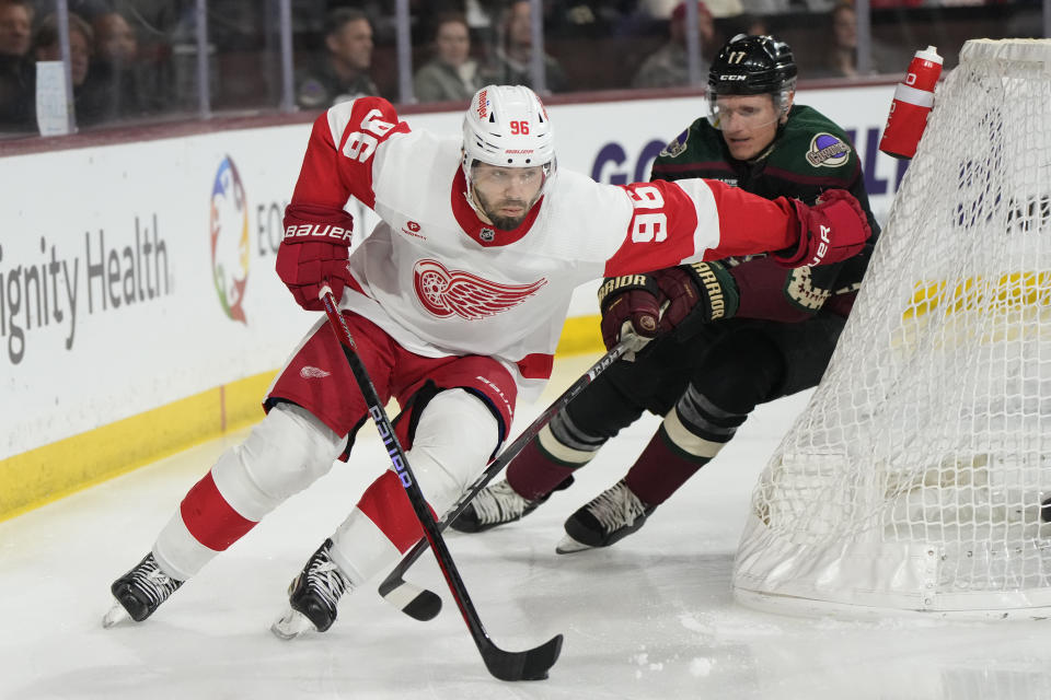 Detroit Red Wings defenseman Jake Walman (96) skates away from Arizona Coyotes center Nick Bjugstad (17) in the first period during an NHL hockey game, Friday, March 8, 2024, in Tempe, Ariz. (AP Photo/Rick Scuteri)