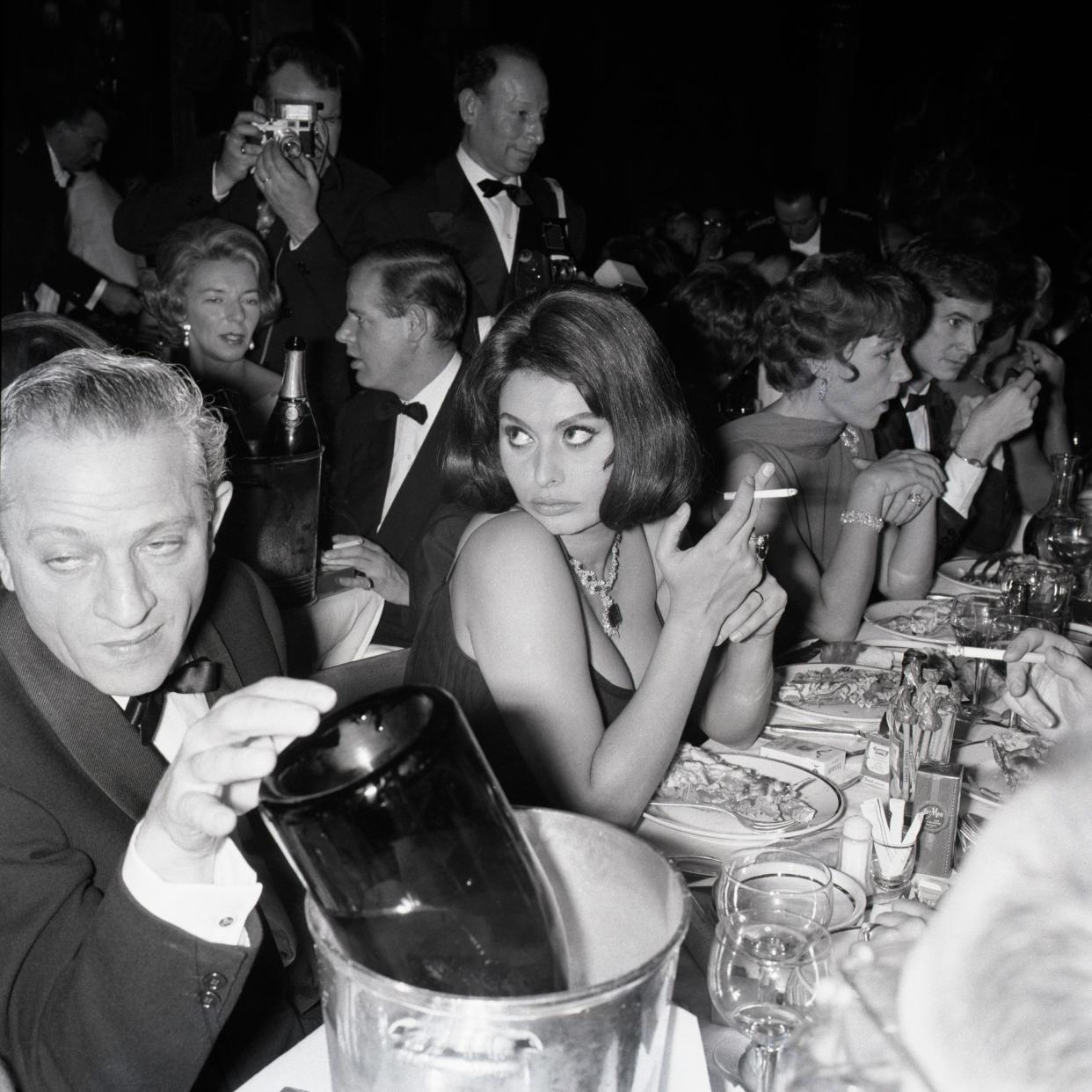 Sophia Loren with the film director Jules Dassin at the Lido nightclub in Paris, 1961 - This content is subject to copyright.