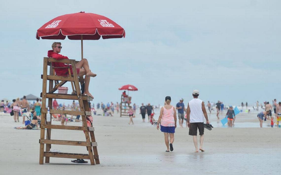 A Shore Beach Service lifeguard keeps watch over swimmers at the beach in a 2017 file photo.