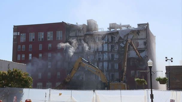 PHOTO: Demolition begins on the six-story apartment building, June 12, 2023, in Davenport, Iowa, after it partially collapsed on May 28. (WQAD)
