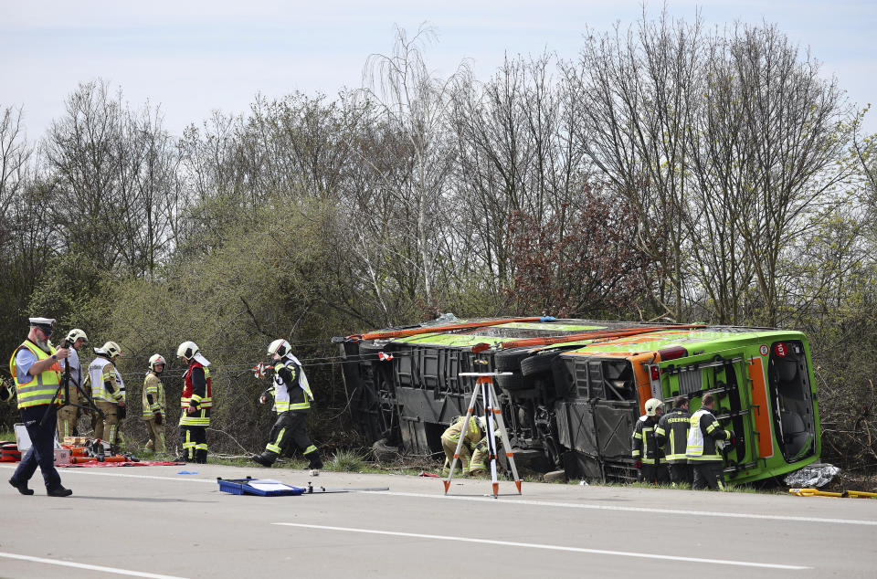 A coach lies overturned on its side at the scene of an accident on the A9, near Schkeuditz, Germany, Wednesday March 27. 2024. (Jan Woitas/dpa via AP)