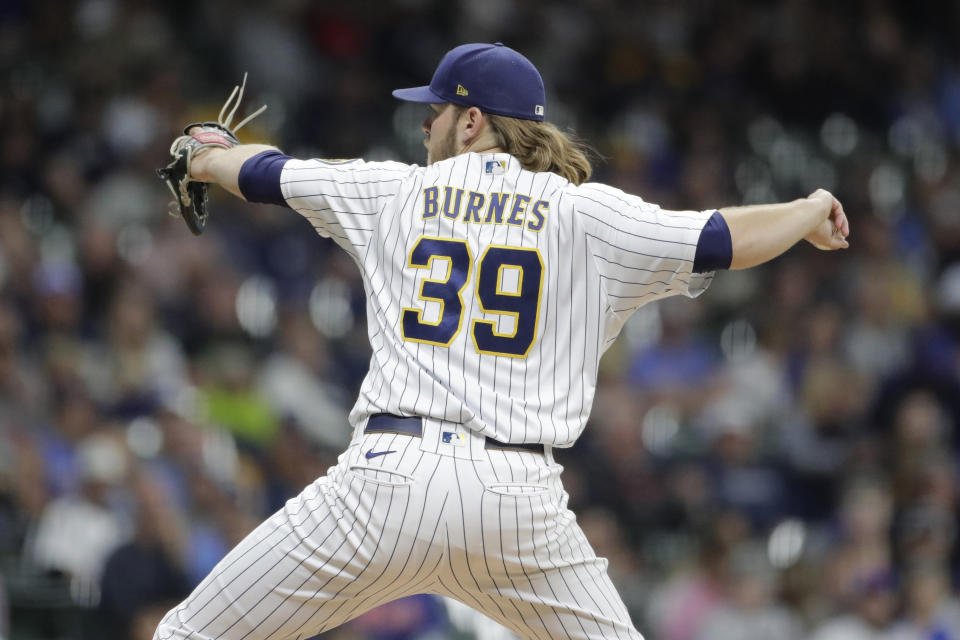 Milwaukee Brewers' Corbin Burnes pitches during the first inning of a baseball game against the New York Mets Saturday, Sept. 25, 2021, in Milwaukee. (AP Photo/Aaron Gash)