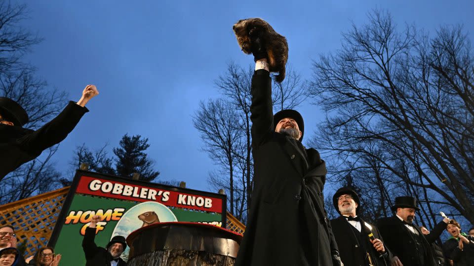 Groundhog Club handler A.J. Dereume holds Punxsutawney Phil, the weather prognosticating groundhog, during the 138th celebration of Groundhog Day in Punxsutawney, Pa., on Friday, Feb. 2, 2024. - Barry Reeger/AP