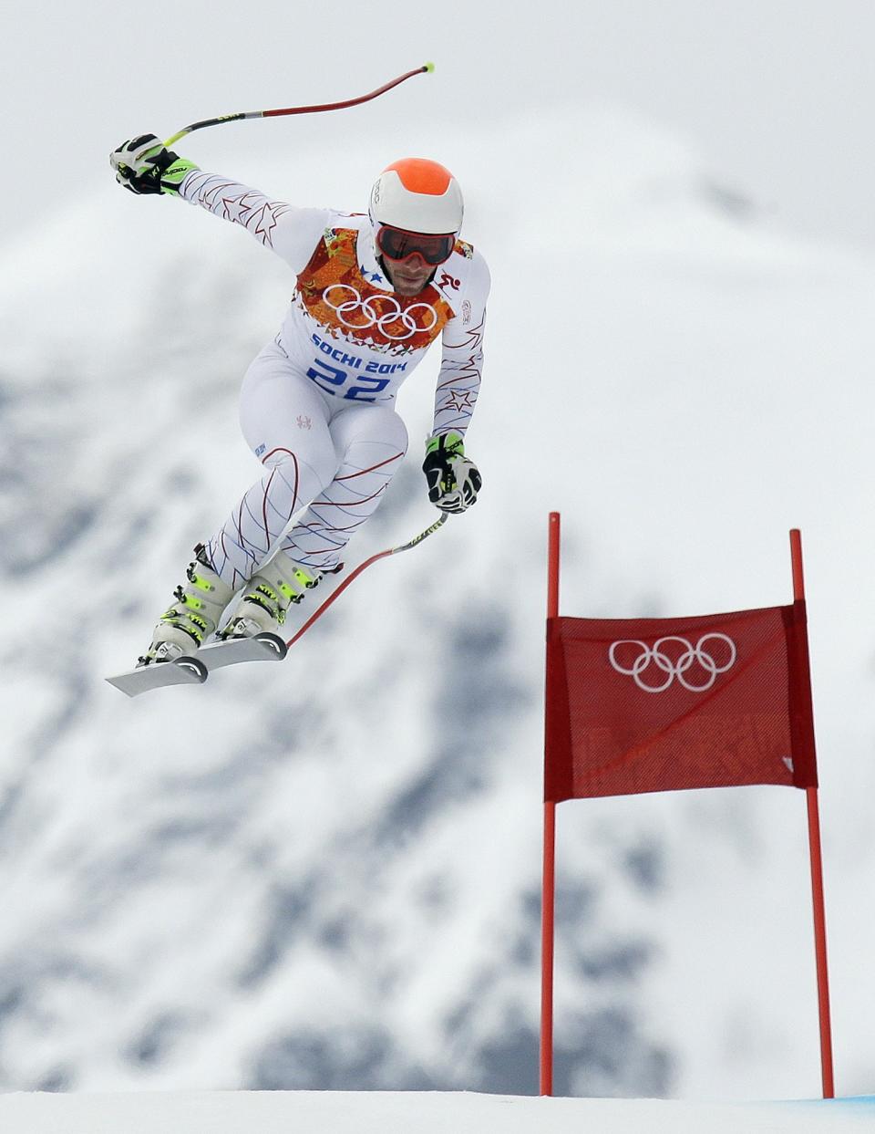 United States' Bode Miller makes a jump during Men's super combined downhill training at the Sochi 2014 Winter Olympics, Tuesday, Feb. 11, 2014, in Krasnaya Polyana, Russia. (AP Photo/Luca Bruno)