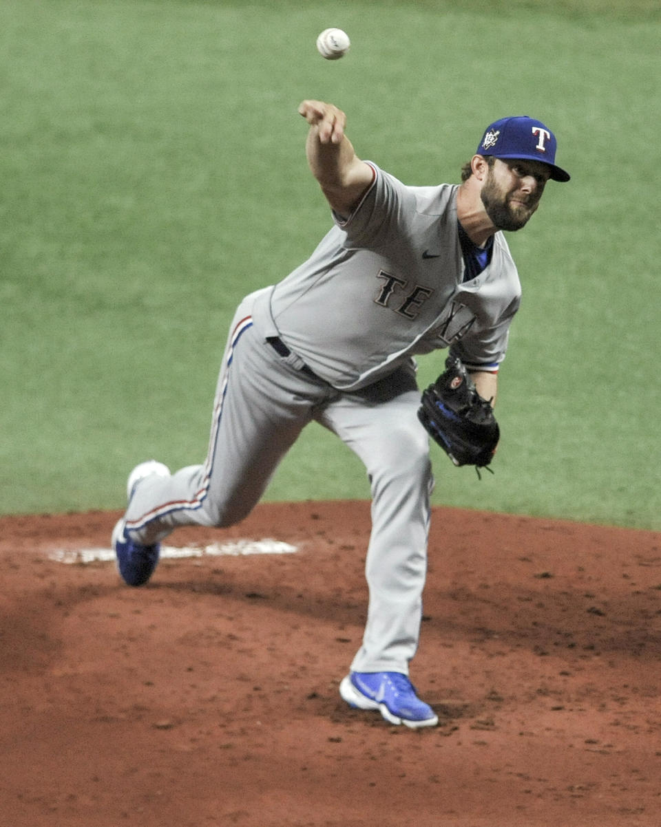 Texas Rangers starter Jordan Lyles pitches to a Tampa Bay Rays batter during the first inning of a baseball game Thursday, April 15, 2021, in St. Petersburg, Fla. (AP Photo/Steve Nesius)